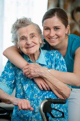 Caregiver assisting an elderly man as he transitions from the hospital to home care, ensuring safety, recovery support, and personalized assistance